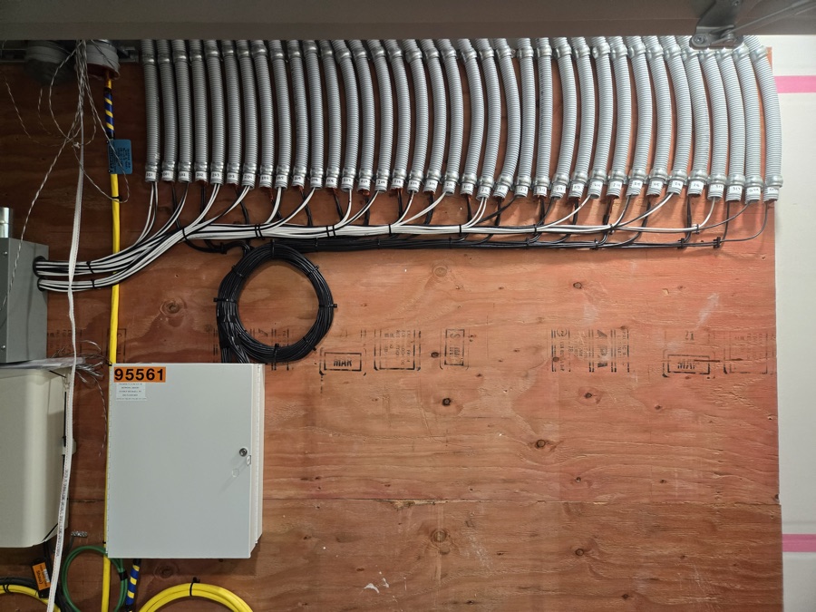 Labeled conduit bank and cable service loop